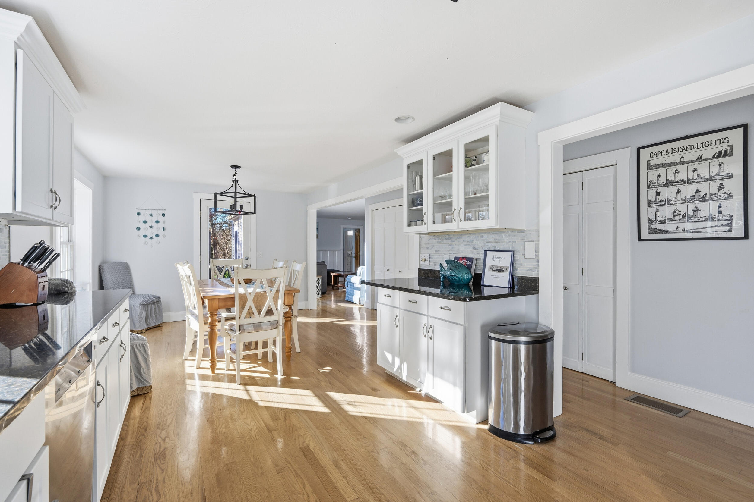 578 Huckins Neck Road Centerville, MA 02632 - Photo 8 of 42 a living room with stainless steel appliances granite countertop a dining table chairs and view of living room