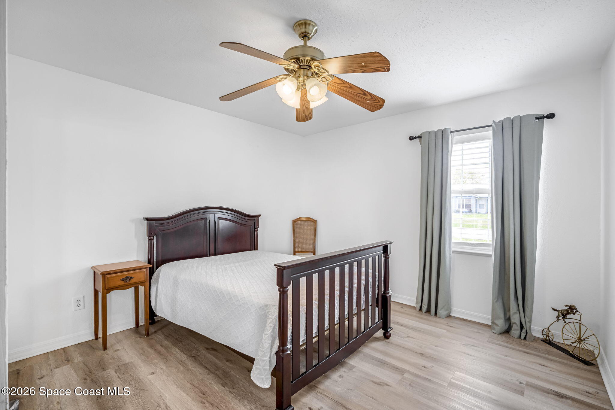 3404 Kilbee Street Mims, FL 32754 - Photo 19 of 30 a bedroom with bed and a window