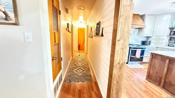 a bathroom with a tub sink and a mirror