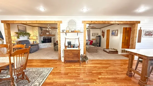 a view of a living room and kitchen