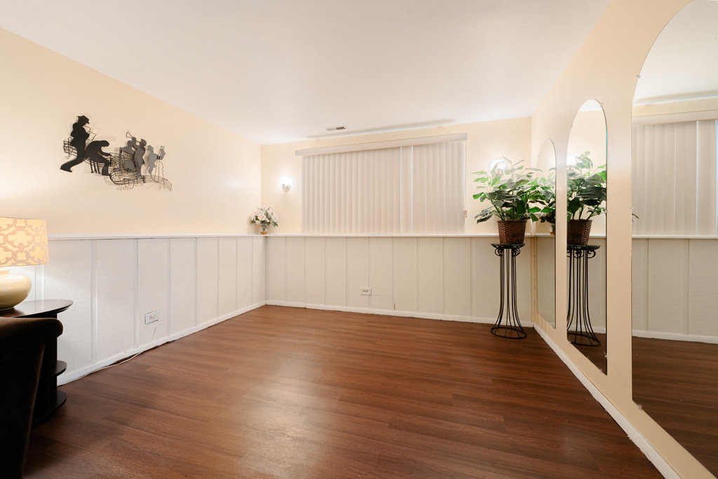 241 Huntingwood Road Matteson, IL 60443 - Photo 15 of 18 wooden floor in an empty room with a window