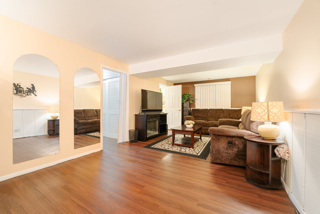 241 Huntingwood Road Matteson, IL 60443 - Photo 17 of 18 a living room with fireplace furniture and a wooden floor