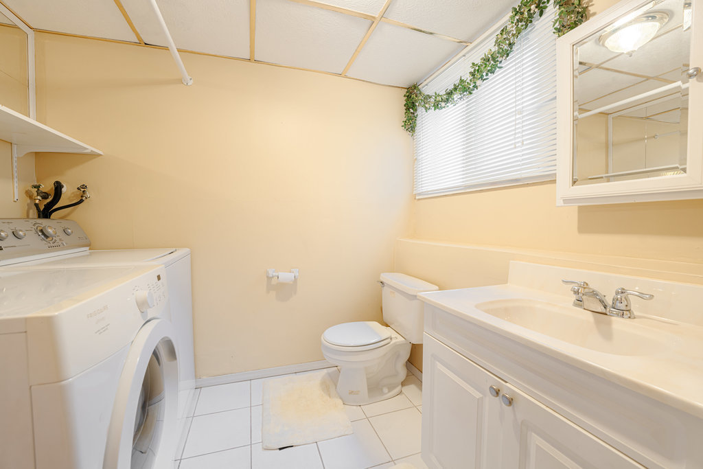 241 Huntingwood Road Matteson, IL 60443 - Photo 18 of 18 a bathroom with a sink toilet and a mirror