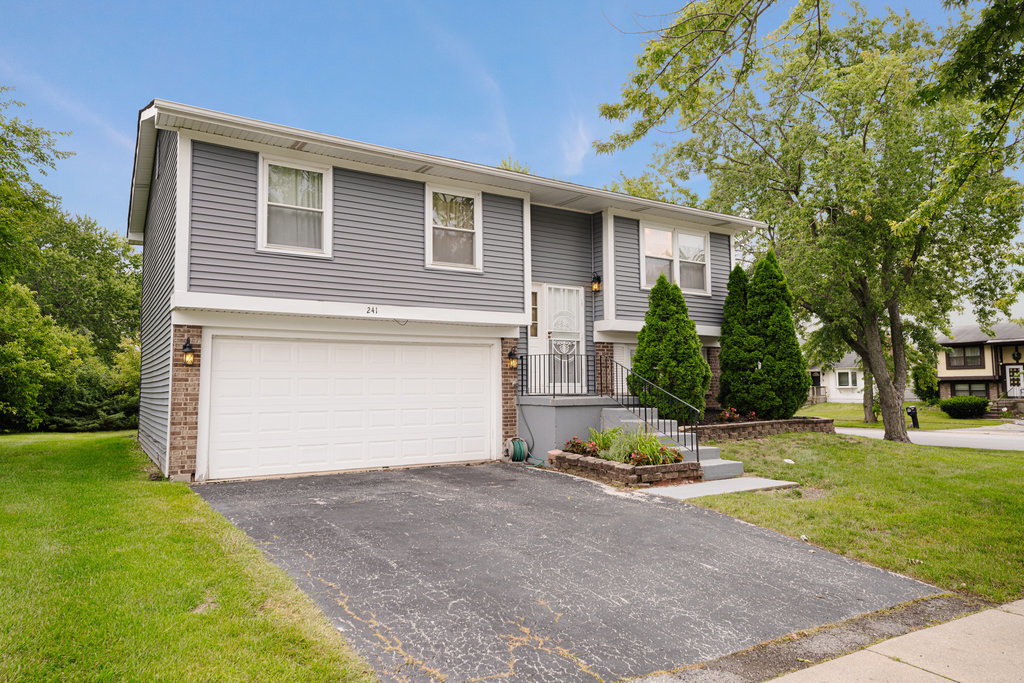 241 Huntingwood Road Matteson, IL 60443 - Photo 2 of 18 a view of a house with backyard and a tree