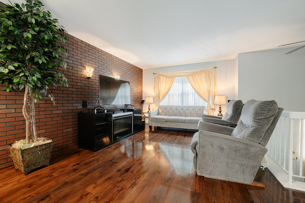 241 Huntingwood Road Matteson, IL 60443 - Photo 4 of 18 a living room with furniture and a flat screen tv
