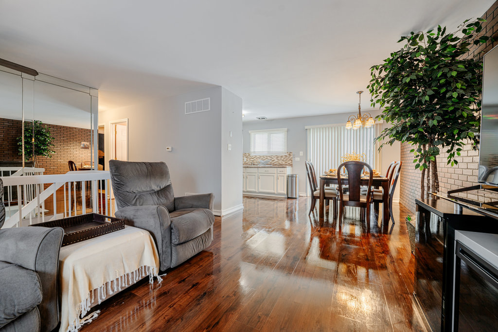 241 Huntingwood Road Matteson, IL 60443 - Photo 5 of 18 a living room with furniture and a wooden floor