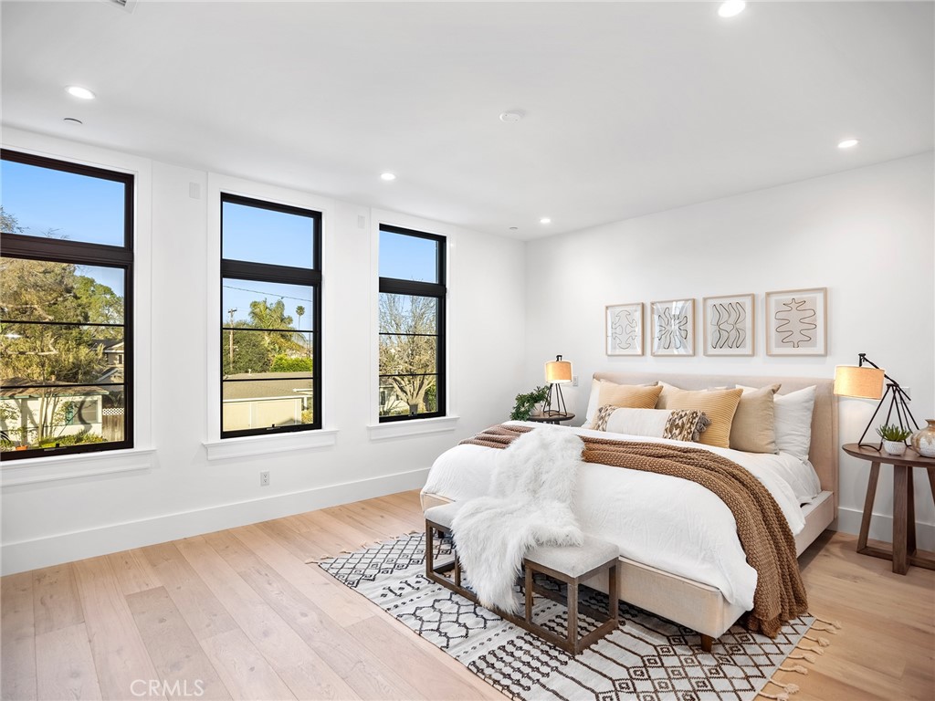 379 La Perle Place Costa Mesa, CA 92627 - Photo 4 of 8 a bedroom with double bed and a window