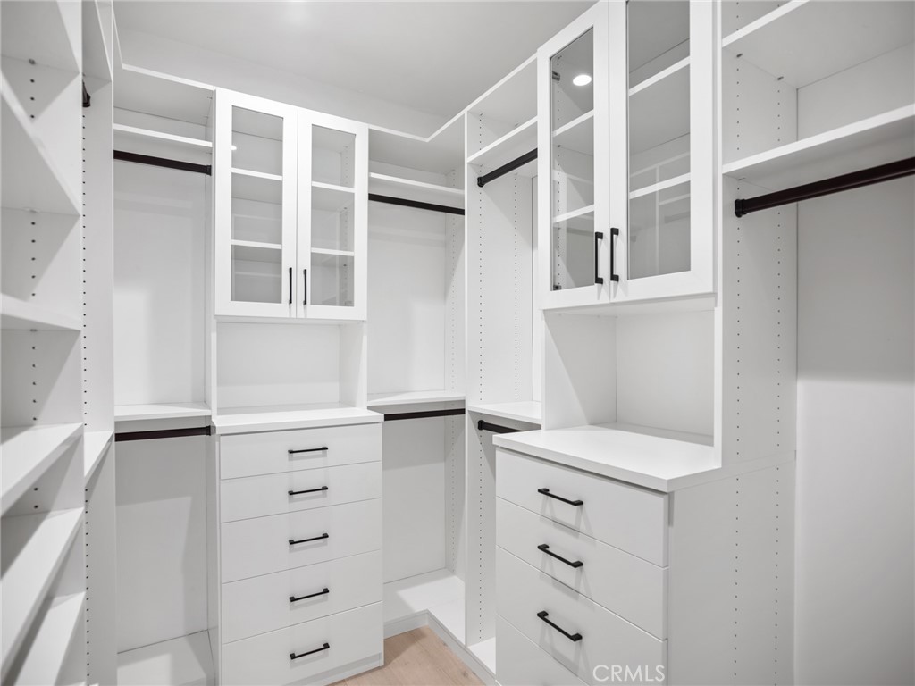 379 La Perle Place Costa Mesa, CA 92627 - Photo 6 of 8 a view of an empty walk in closet