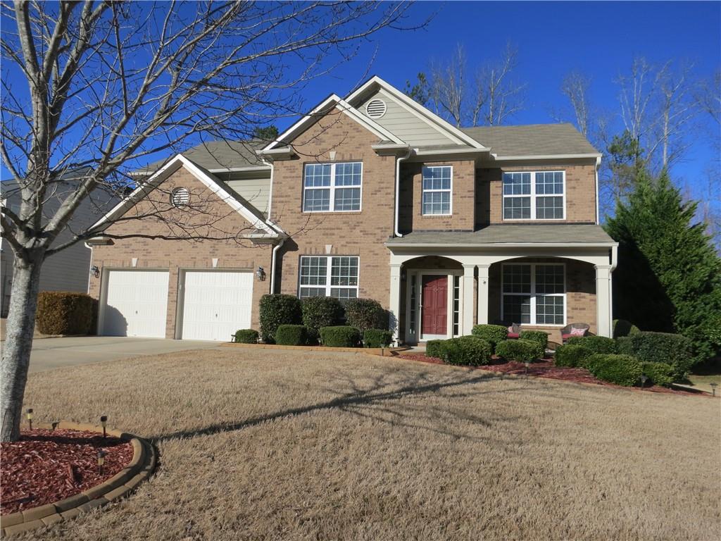 5170 Pinto Pass Cumming, GA 30040 - Photo 1 of 1 a front view of a house with a yard