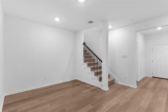 a view of entryway with wooden floor