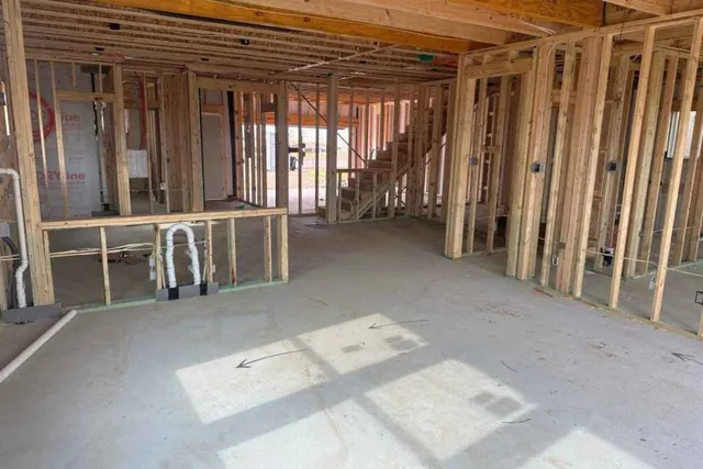 a view of an empty room with windows