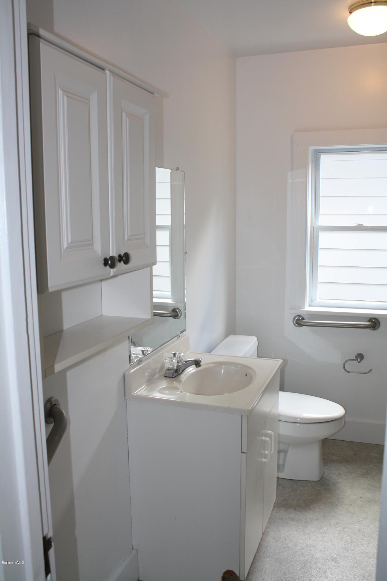 340 Main Road Monterey, MA 01245 - Photo 7 of 13 a bathroom with a sink toilet and vanity