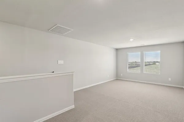 an empty room with a empty space and window