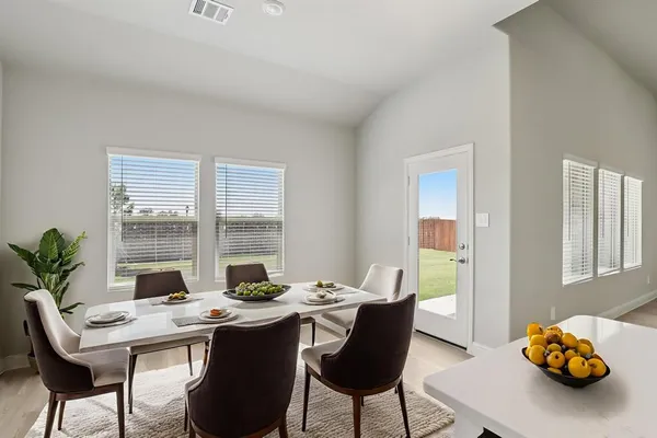 a view of a dining room with furniture window and outside view