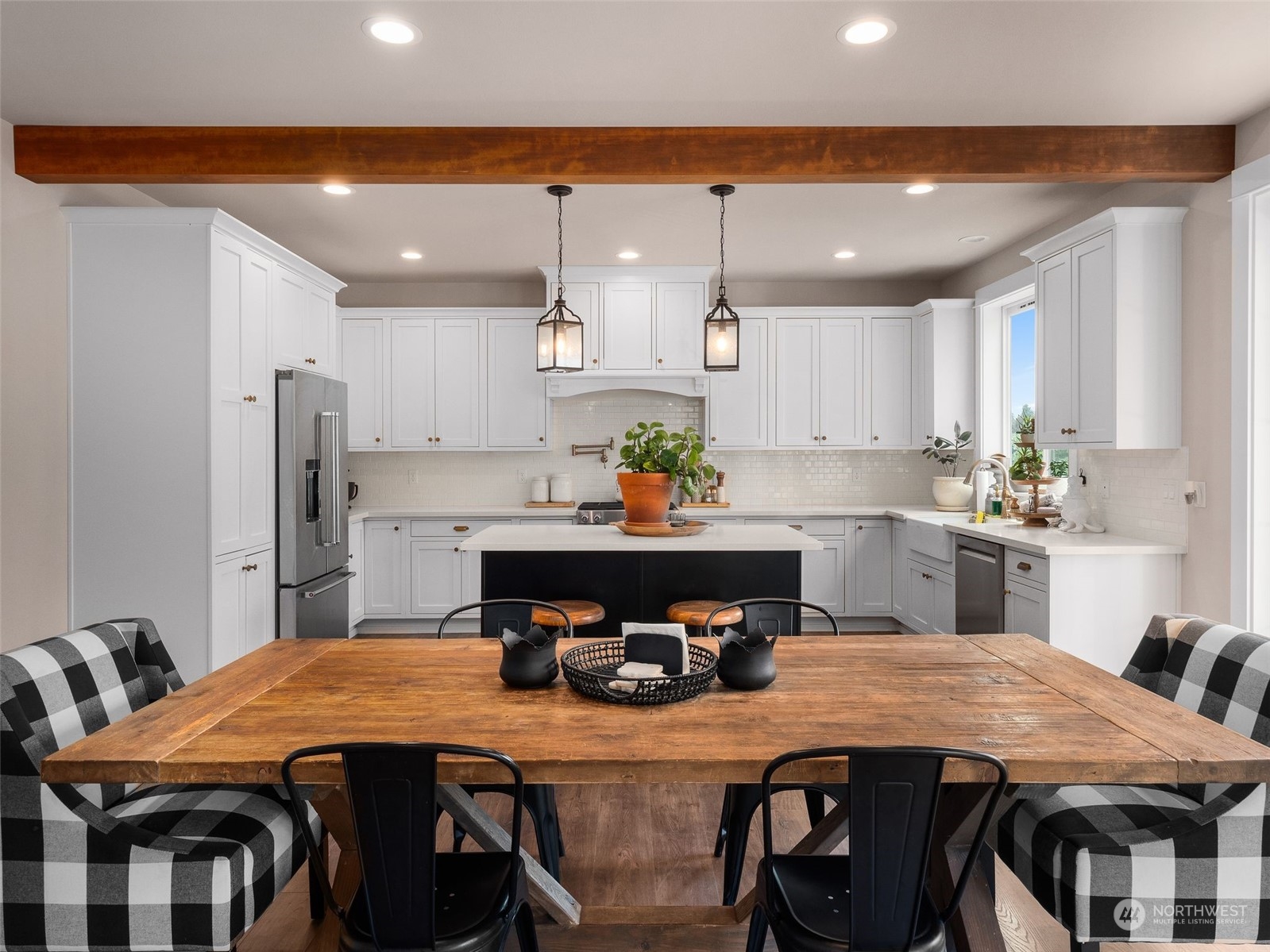 2440 Callow Road Lake Stevens, WA 98258 - Photo 1 of 34 a kitchen with a table chairs sink and cabinets