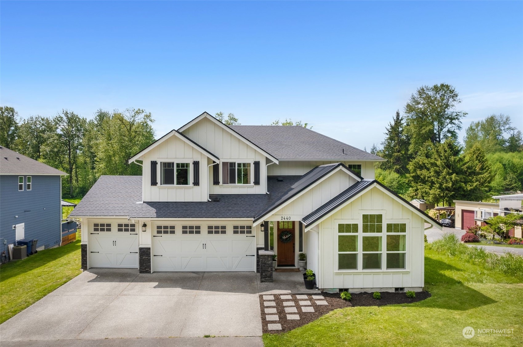 2440 Callow Road Lake Stevens, WA 98258 - Photo 3 of 34 a view of a big house with a big yard and large trees