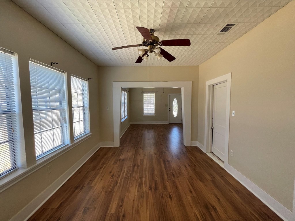 3105 Indiana Street Baytown, TX 77520 - Photo 2 of 10 a view of empty room with wooden floor and fan
