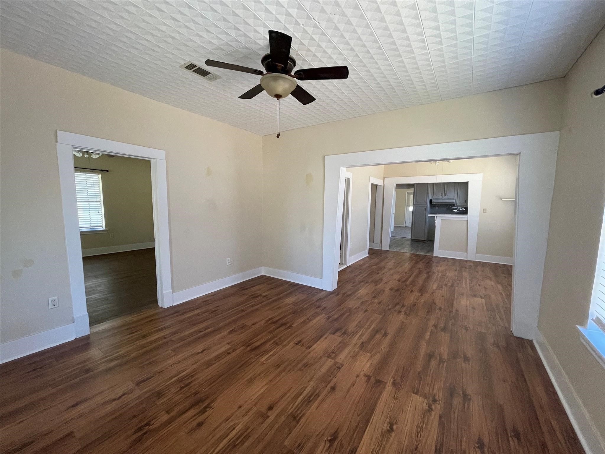 3105 Indiana Street Baytown, TX 77520 - Photo 4 of 10 a view of empty room with wooden floor