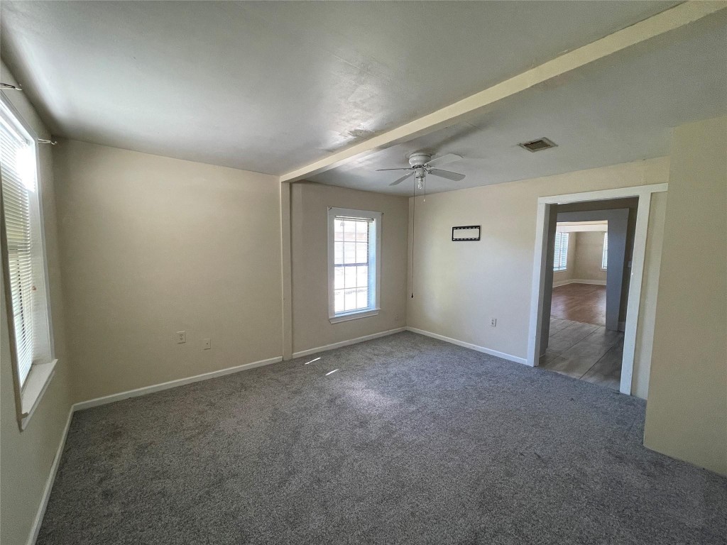 3105 Indiana Street Baytown, TX 77520 - Photo 9 of 10 an empty room with windows and closet