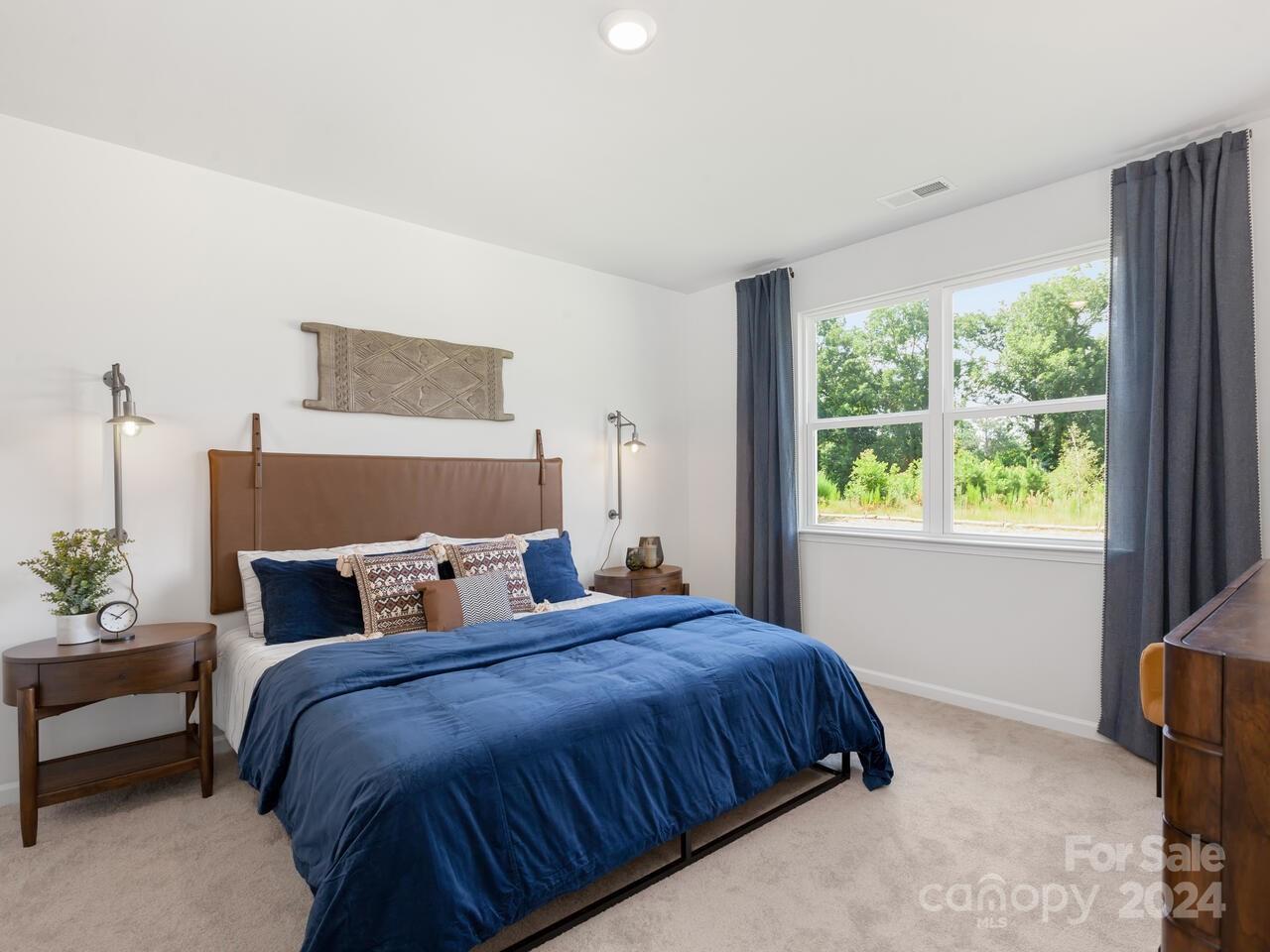 1965 Vanderlyn Street Monroe, NC 28112 - Photo 13 of 16 a bedroom with bed and window