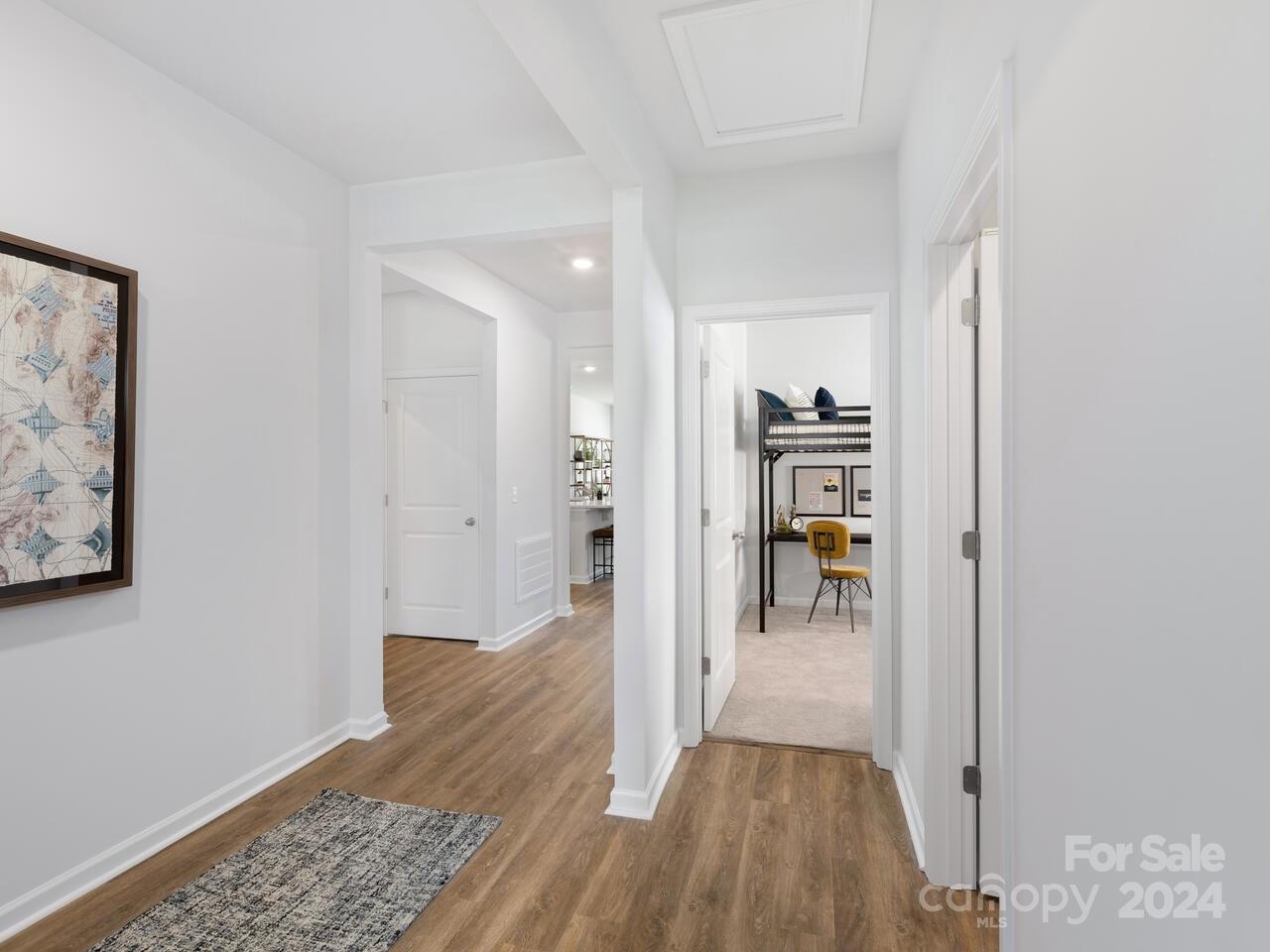 1965 Vanderlyn Street Monroe, NC 28112 - Photo 2 of 16 a view of a hallway view with wooden floor and windows