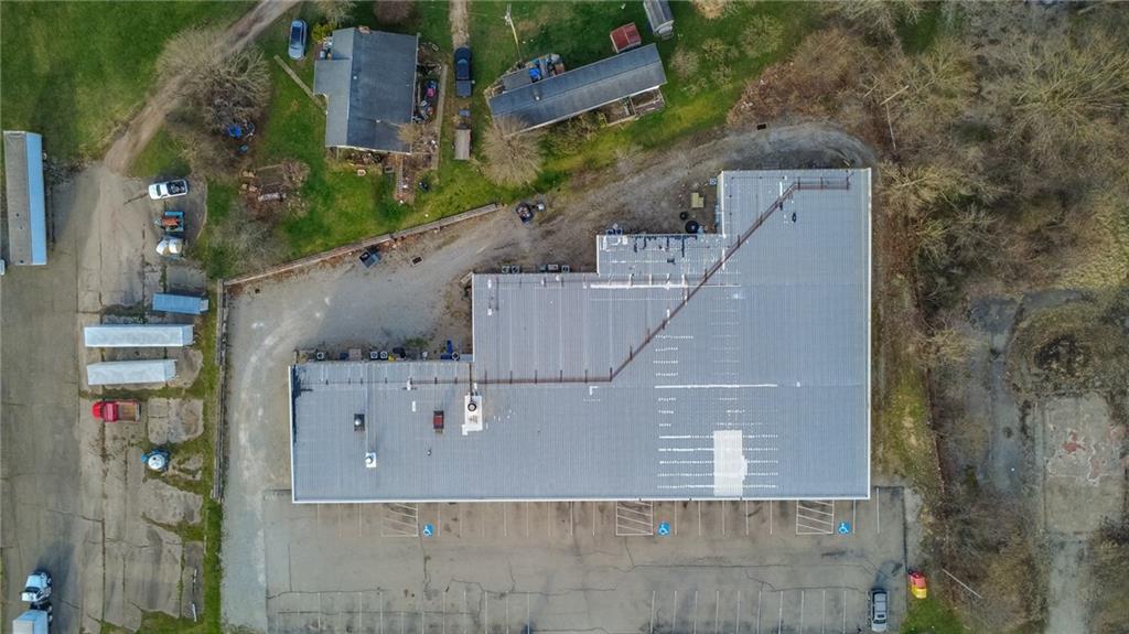 3379 Pittsburgh Street, Unit 109 Perryopolis, PA 15473 - Photo 11 of 47 an aerial view of a house with outdoor space and parking