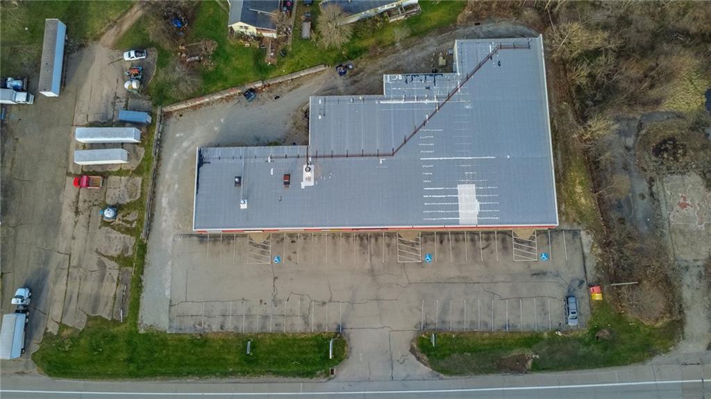 3379 Pittsburgh Street, Unit 109 Perryopolis, PA 15473 - Photo 12 of 47 an aerial view of a house with a yard