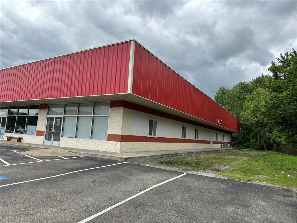 3379 Pittsburgh Street, Unit 109 Perryopolis, PA 15473 - Photo 15 of 47 a house with trees in front of it
