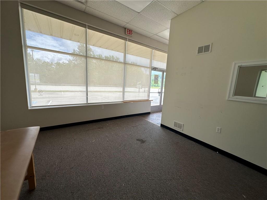 3379 Pittsburgh Street, Unit 109 Perryopolis, PA 15473 - Photo 17 of 47 a view of an empty room with a window