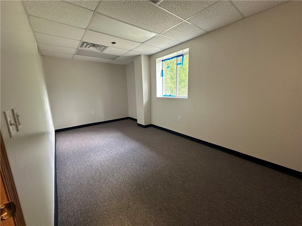 3379 Pittsburgh Street, Unit 109 Perryopolis, PA 15473 - Photo 36 of 47 an empty room with a empty space and windows