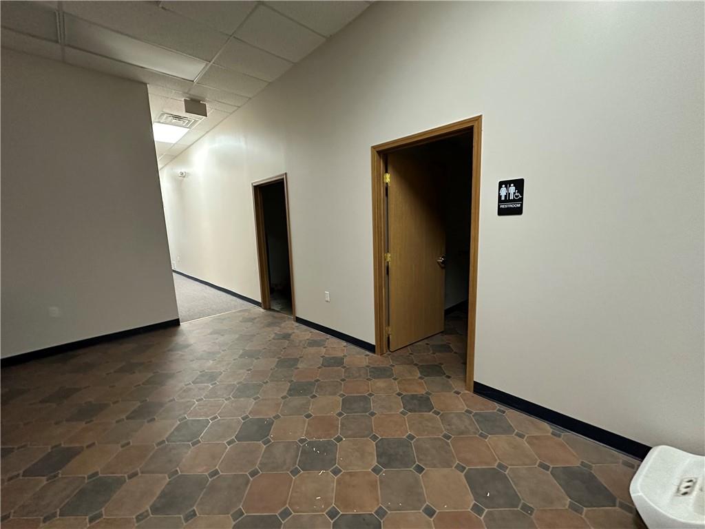3379 Pittsburgh Street, Unit 109 Perryopolis, PA 15473 - Photo 40 of 47 an empty room with wooden floor and closet
