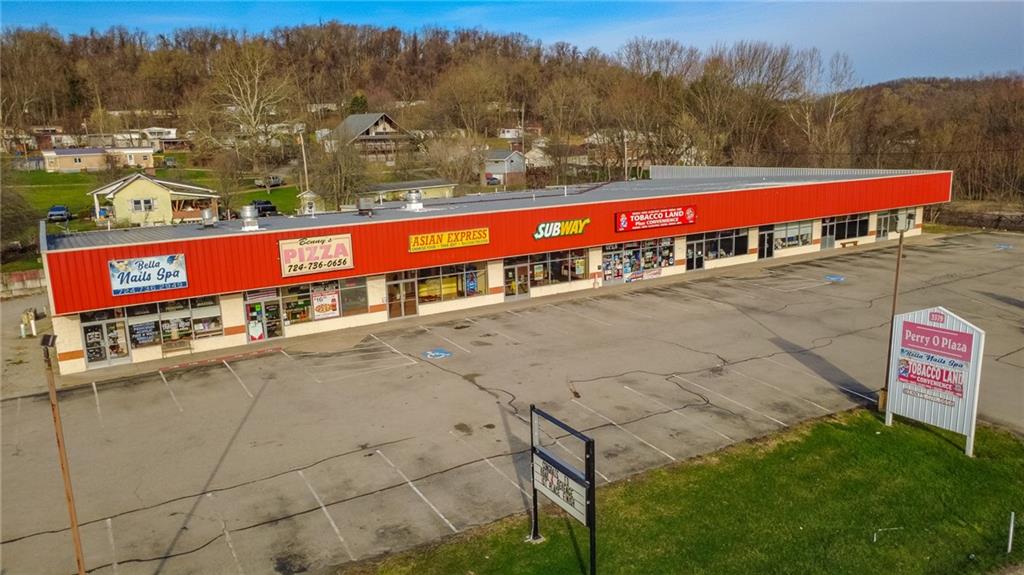 3379 Pittsburgh Street, Unit 109 Perryopolis, PA 15473 - Photo 4 of 47 a view of a swimming pool with a yard and mountain view