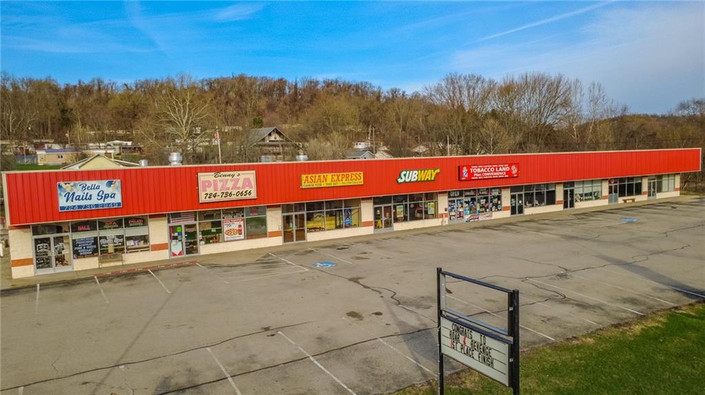 3379 Pittsburgh Street, Unit 109 Perryopolis, PA 15473 - Photo 42 of 47 a view of a street with trees