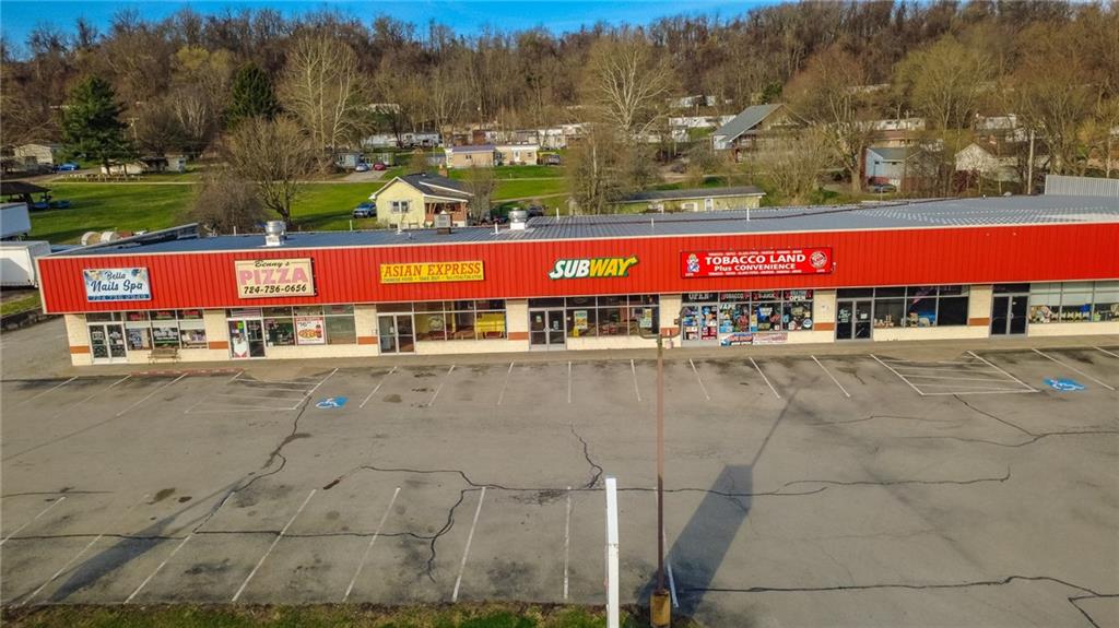 3379 Pittsburgh Street, Unit 109 Perryopolis, PA 15473 - Photo 5 of 47 a view of swimming pool with outdoor seating and yard