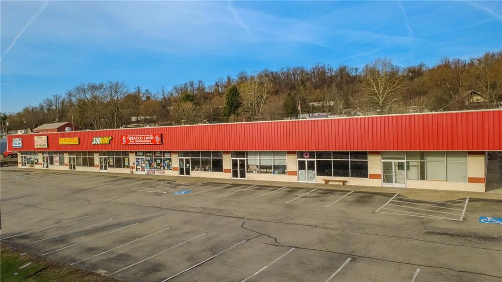 3379 Pittsburgh Street, Unit 109 Perryopolis, PA 15473 - Photo 6 of 47 a view of swimming pool with a yard and trees