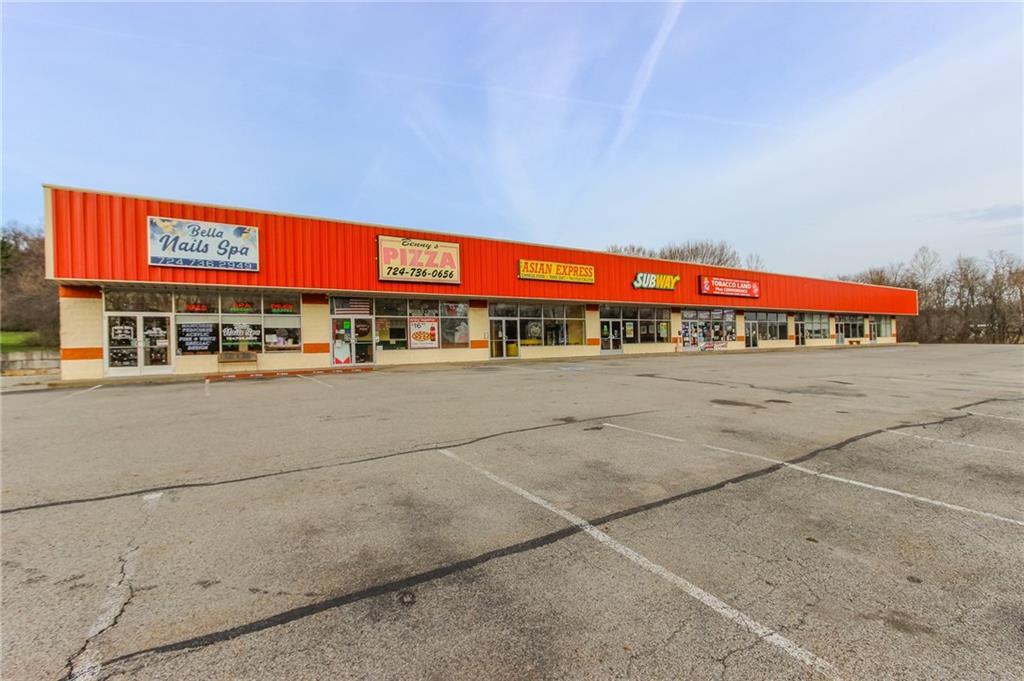 3379 Pittsburgh Street, Unit 109 Perryopolis, PA 15473 - Photo 8 of 47 a view of a parking area