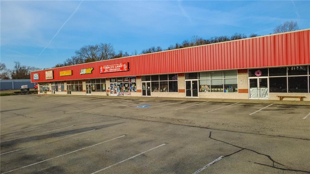 3379 Pittsburgh Street, Unit 109 Perryopolis, PA 15473 - Photo 9 of 47 a group of people sitting in front of a building