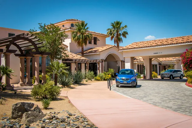 a kitchen with stainless steel appliances kitchen island granite countertop a sink and cabinets