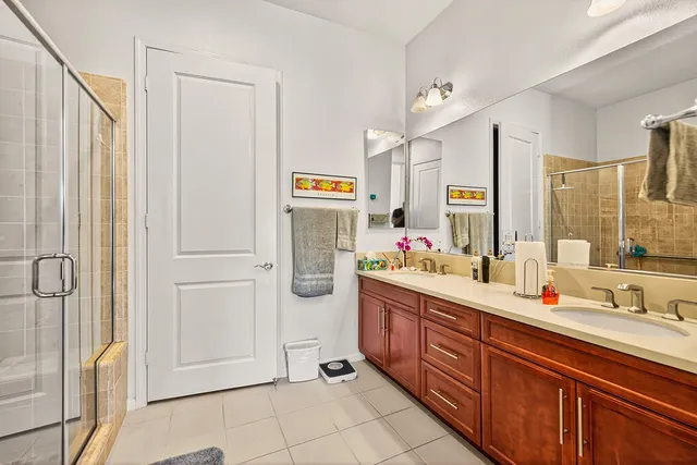 a bathroom with a shower and a sink