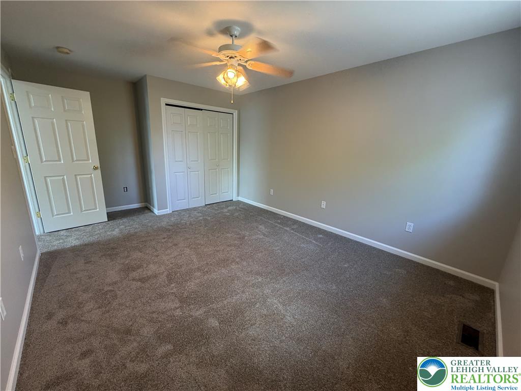 4157 Walter Road Bethlehem, PA 18020 - Photo 25 of 36 A well-lit room featuring neutral walls and cozy carpeting awaits personal touches.