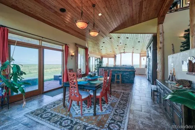 a kitchen with stainless steel appliances granite countertop a sink a stove and a wooden cabinets