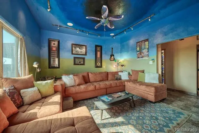 a bedroom with a bed and lamp on dresser