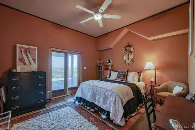 a bedroom with a bed lamps and window
