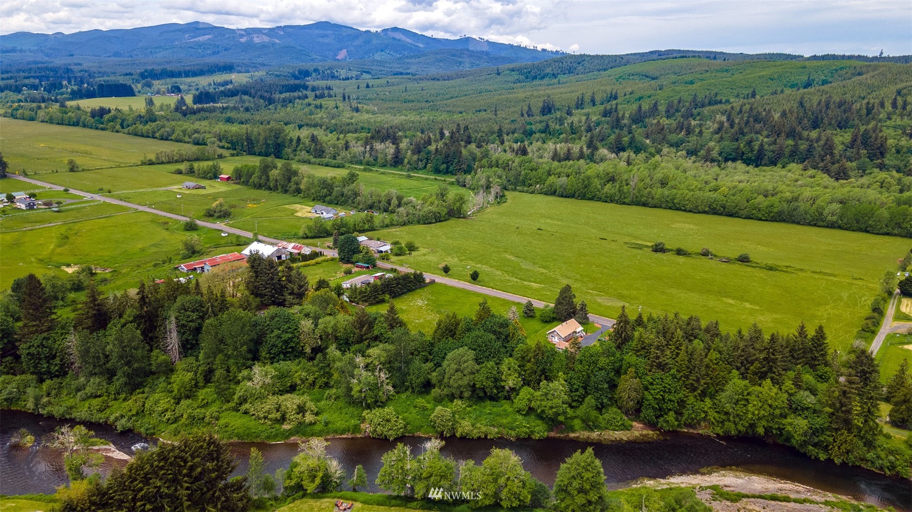 517 Leudinghaus Road Chehalis, WA 98532 - Photo 37 of 37 an aerial view of green landscape with trees houses and mountain view