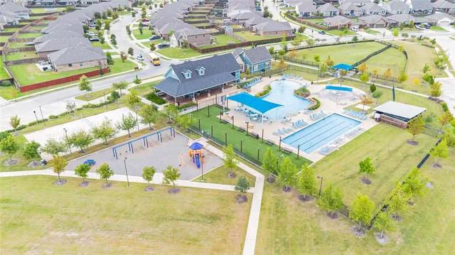 an aerial view of residential house with swimming pool