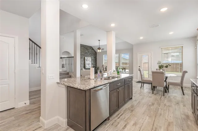 a kitchen with counter space and wooden floor