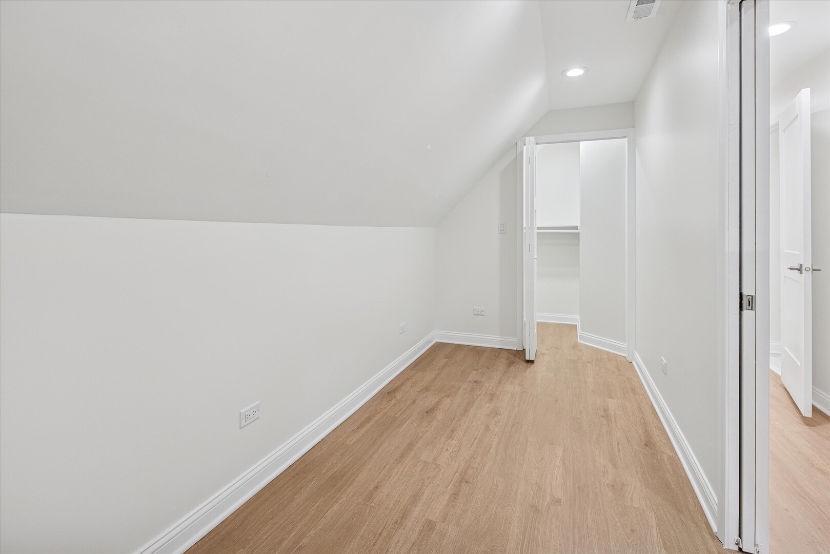 3818 North Hermitage Avenue, Unit 2 Chicago, IL 60613 - Photo 12 of 16 a view of an empty room with wooden floor