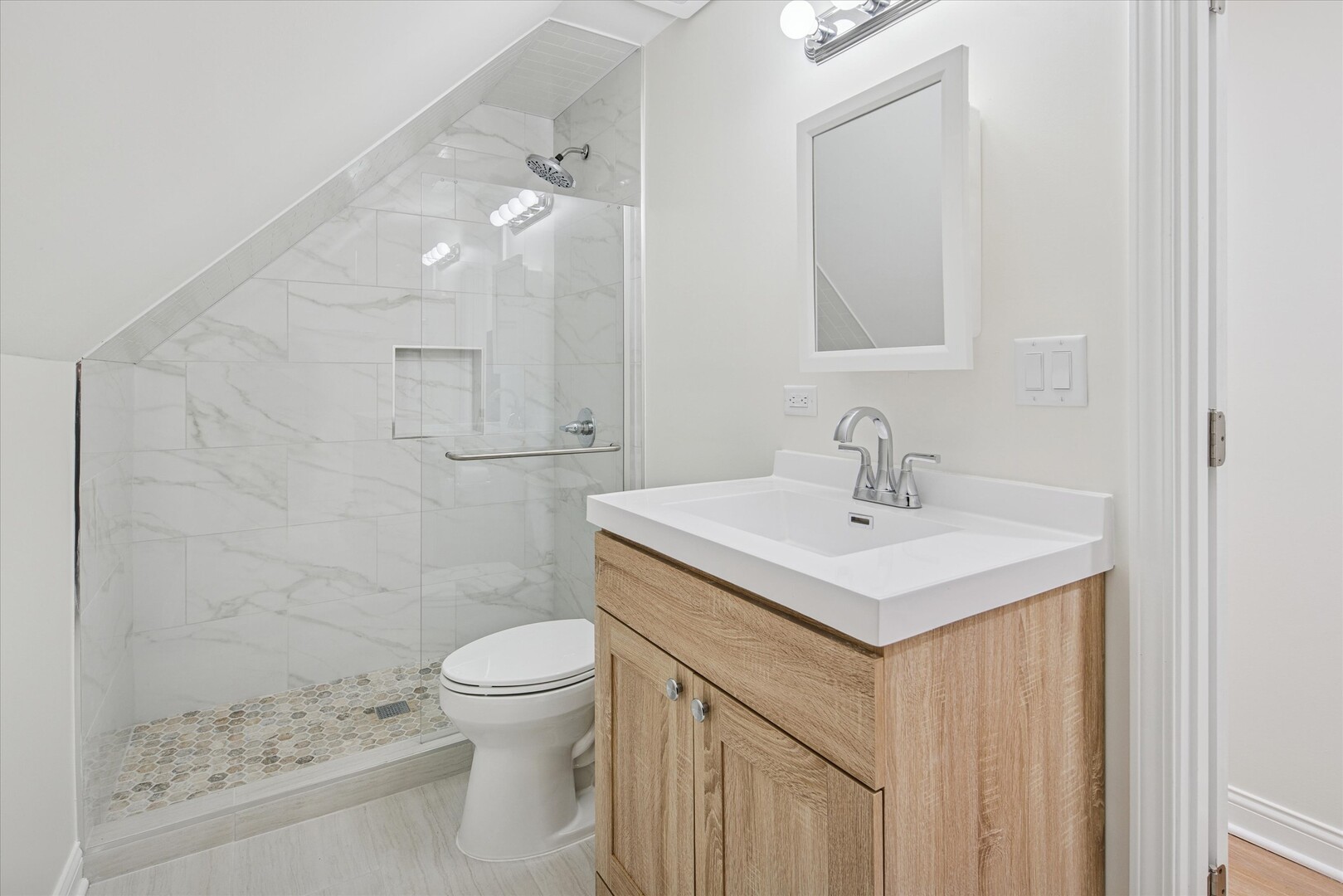 3818 North Hermitage Avenue, Unit 2 Chicago, IL 60613 - Photo 13 of 16 a bathroom with a sink a toilet and shower