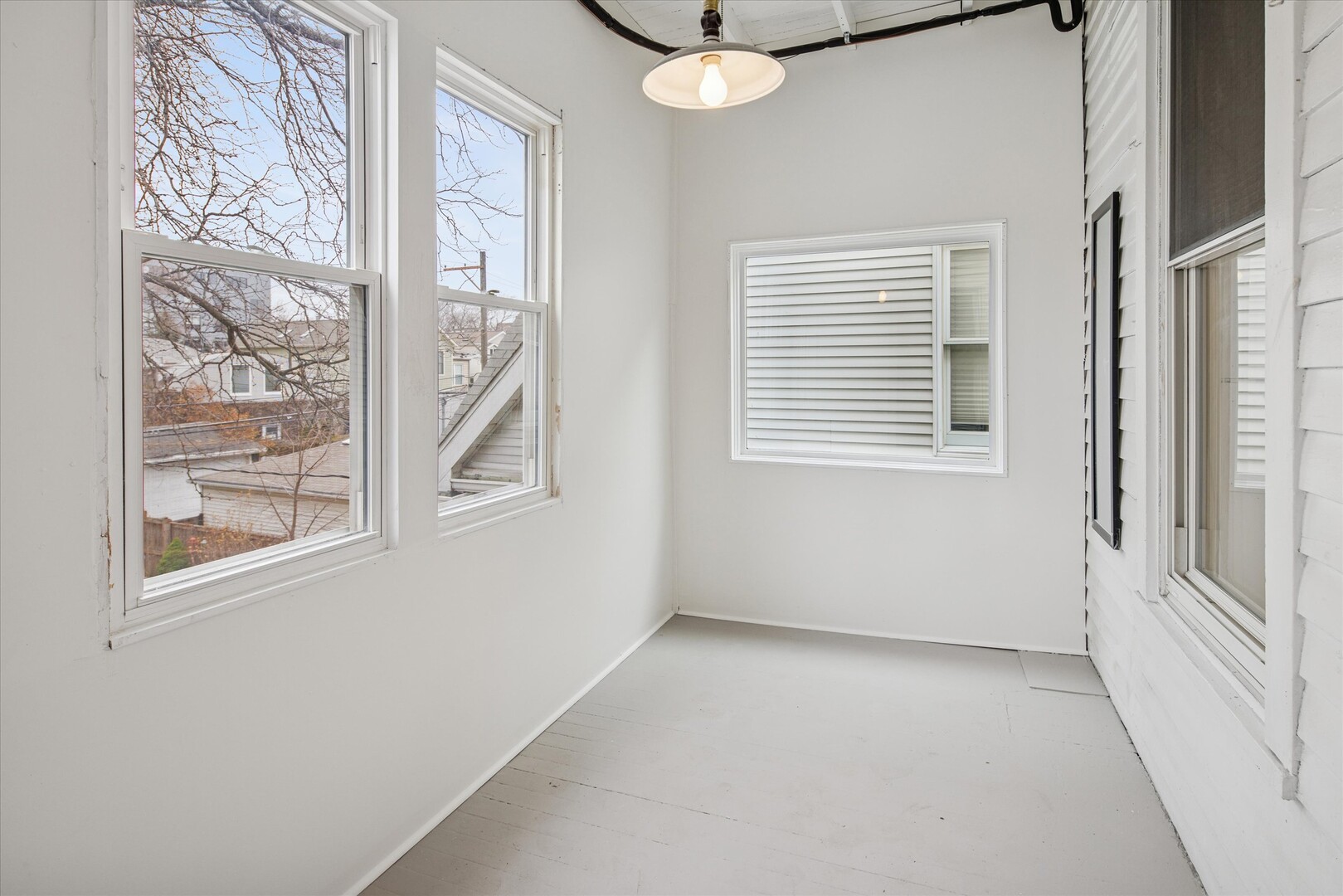3818 North Hermitage Avenue, Unit 2 Chicago, IL 60613 - Photo 7 of 16 a view of an empty room with a window