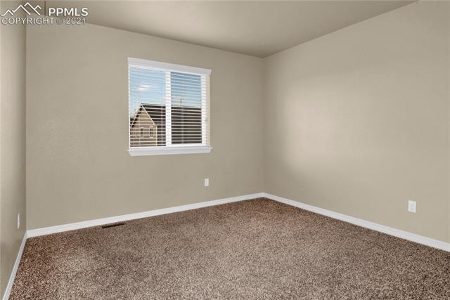 6162 Pilgrimage Road Colorado Springs, CO 80925 - Photo 12 of 19 Upper level Bedroom 2